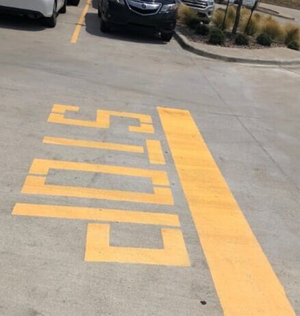 Pavement marking of yellow stop in Choctaw, OK